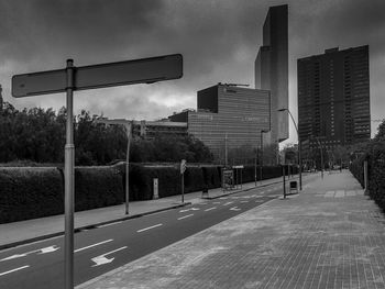 View of basketball hoop in city against sky