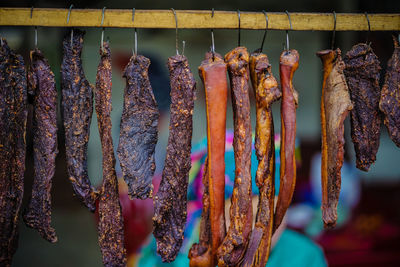 Clothes hanging for sale at market stall