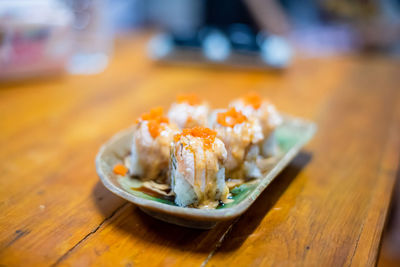 Close-up of sushi in plate on table