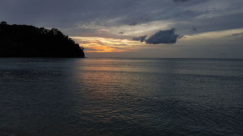 Scenic view of sea against sky at sunset