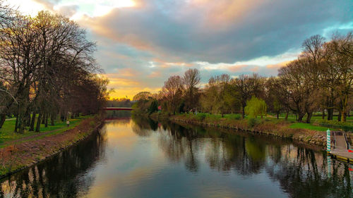 Scenic view of lake against cloudy sky