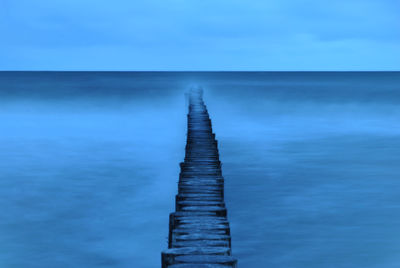Scenic view of sea against blue sky