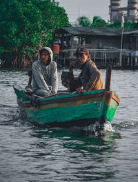 Man and woman sitting in boat
