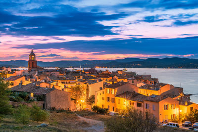 Scenic view of saint-tropez after sunset with city lights turned on