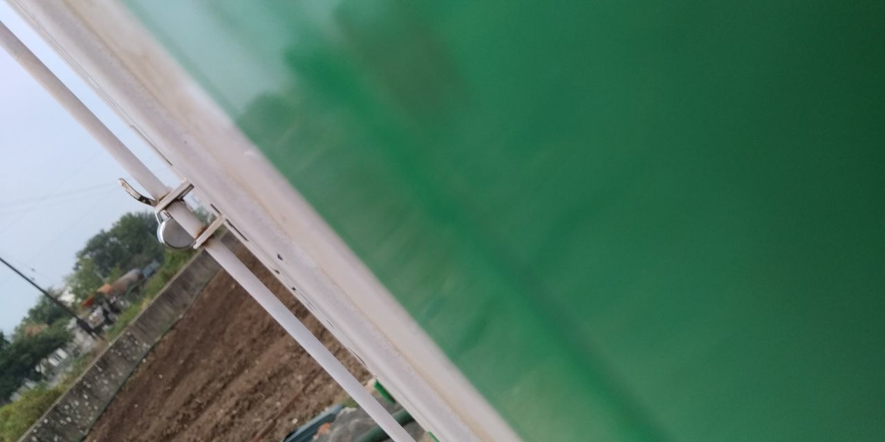 CLOSE-UP OF LADDER BY SWIMMING POOL