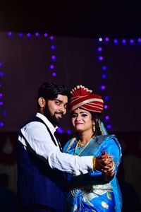 Stage show of young couple in happy mood 