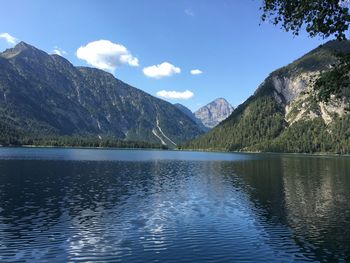 Scenic view of lake and mountains against sky