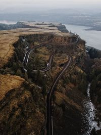 High angle view of road by river against sky