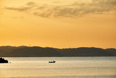 Scenic view of sea against sky during sunrise