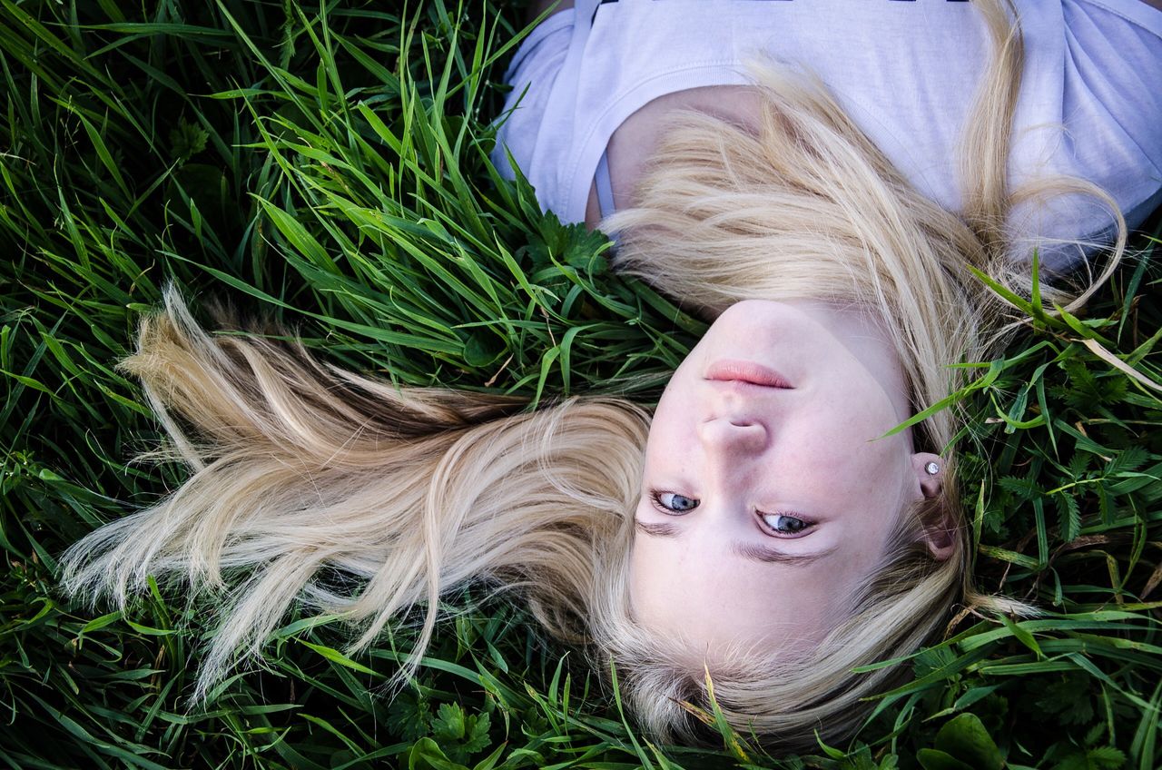 plant, growth, grass, person, young adult, young women, looking at camera, portrait, green color, lifestyles, field, headshot, nature, leisure activity, tree, front view, long hair, close-up