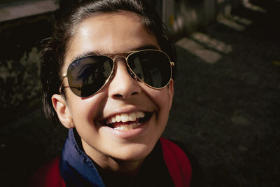 Portrait of young woman wearing sunglasses
