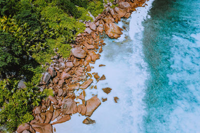 High angle view of rocks by sea