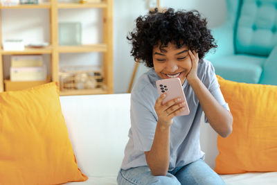 Young woman using mobile phone