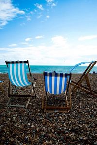 Scenic view of beach against blue sky