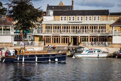 View of boats in canal along buildings