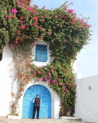 Low angle view of person by tree against plants