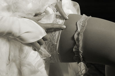 Midsection of bride wearing stockings