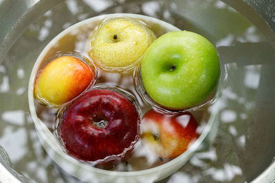 High angle view of fruits in glass on table