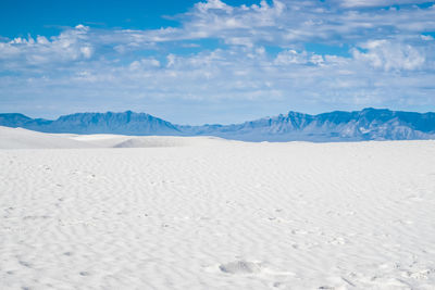 Scenic view of arid landscape against sky