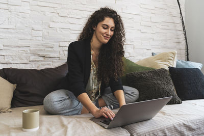 Young woman using phone