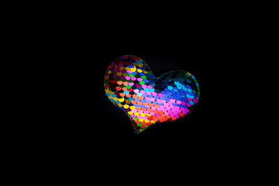 Close-up of heart shape against black background