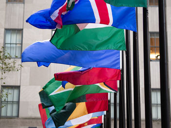 Low angle view of flags against the sky