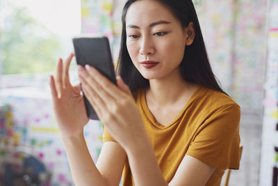 Young woman using mobile phone