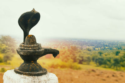 Close-up of statue against sky