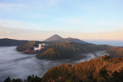 Scenic view of volcanic landscape against sky during sunset