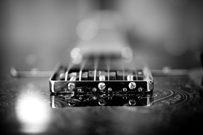 Close-up of guitar on table