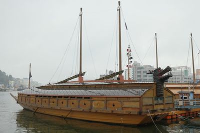 Boats moored at harbor
