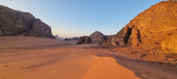 Scenic view of desert against clear sky