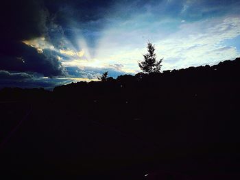 Scenic view of landscape against sky at sunset