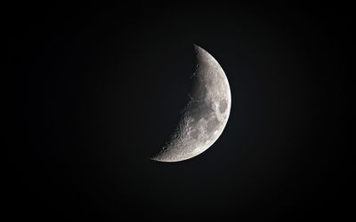 Low angle view of moon against clear sky at night