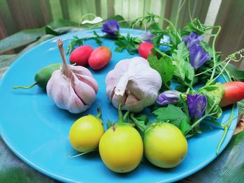 High angle view of fruits in plate on table