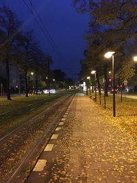 View of illuminated street lights at night