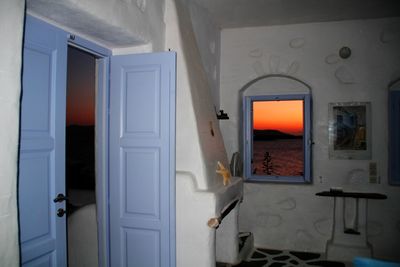 Scenic view of sunset through window