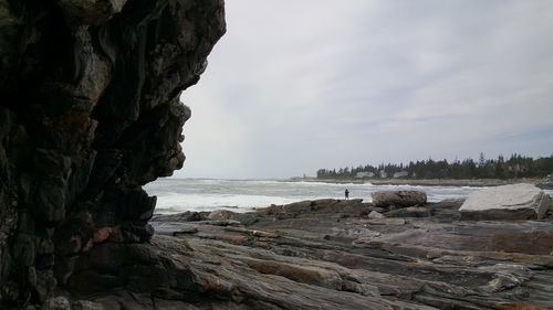 Scenic view of sea against cloudy sky