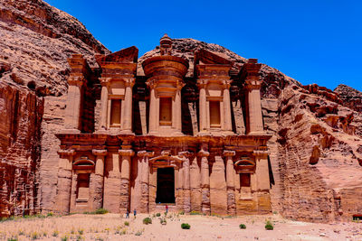 Exterior of temple against clear blue sky