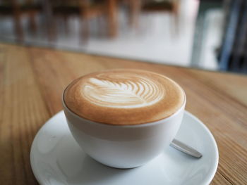 Close-up of cappuccino on table