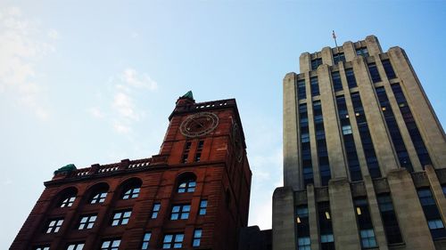 Low angle view of clock tower against sky