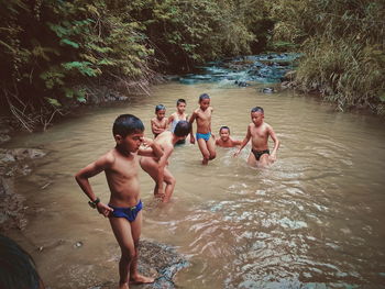 High angle view of people enjoying in water