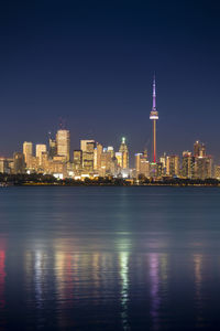 Illuminated buildings in city at night