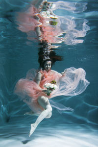 Woman swimming in sea