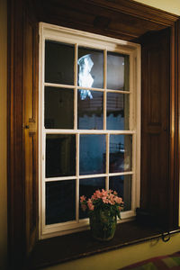 Flowers on window of building
