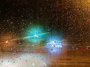 Close-up of raindrops on windshield