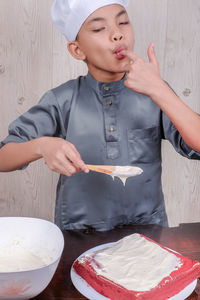 Boy preparing food in kitchen