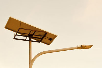 Low angle view of street light against sky