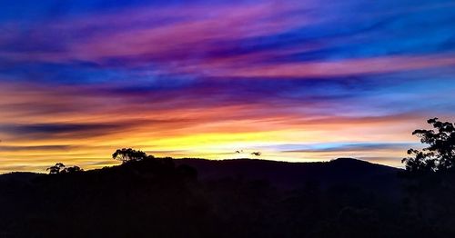 Scenic view of dramatic sky during sunset