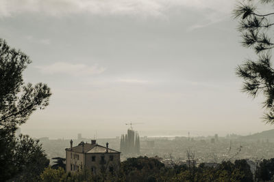 Buildings in city against sky